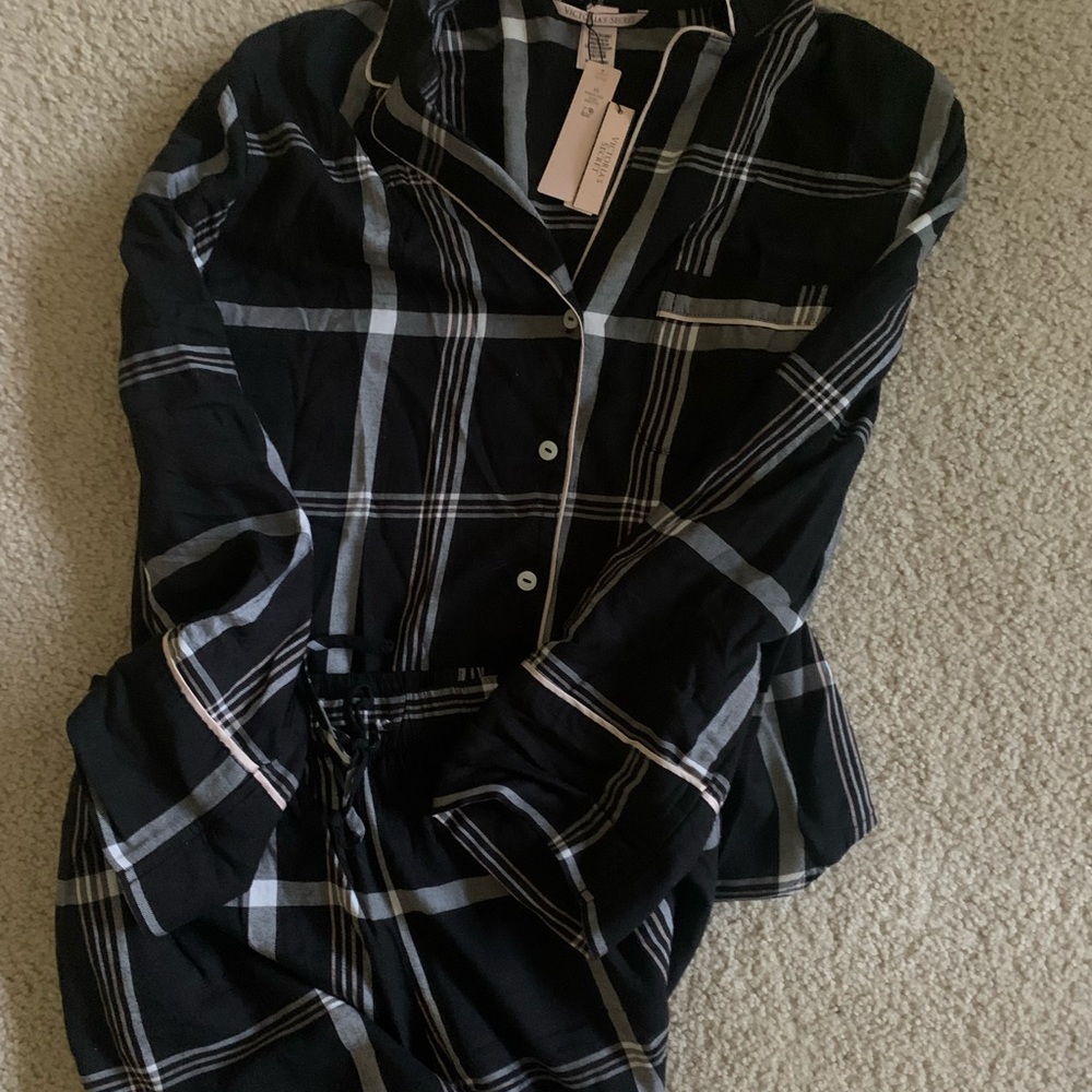 Victoria secret button down long sleeve pajama top and pajama pants bottoms.
